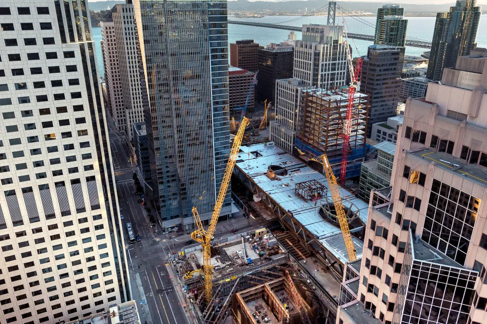 View looking down on construction of multiple buildings in San Francisco's Transbay Transit Center District